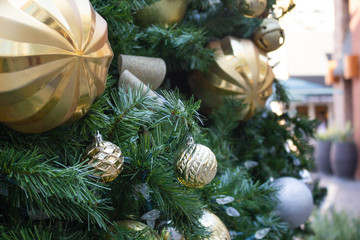 Wall Mural - A closeup of Christmas tree ornament balls on display during the holiday season.