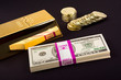Gold bar and coins on black
