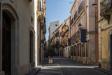 Fototapeta Miasto - Picturesque street in Ortigia, Siracusa old town, Sicily, southern Italy