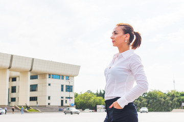 young successful business woman looking at the city