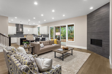 Living room and kitchen in new modern home with open concept floor plan.