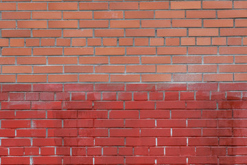 Wall Mural - background of a red and orange brick wall. 