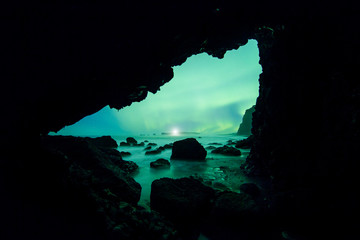 Wall Mural - Aurora Borealis (Northern Lights) from an ocean cave