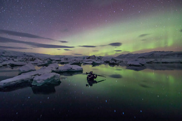 Wall Mural - Aurora Borealis (Northern Lights) above Jokulsarlon Glacier Lagoon with photographer