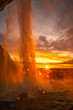 beautiful sunset at the Seljalandsfoss waterfall in Iceland. View from behind the water