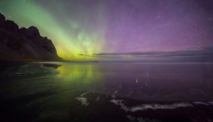 Aurora Borealis (Northern Lights) above Stokksnes Beach and Vestrahorn Mountains, Iceland