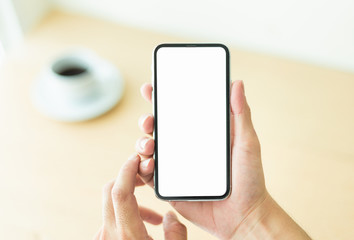 Mockup image blank white screen cell phone.woman hand holding texting using mobile.background empty space for advertise text.people contact marketing business,technology 