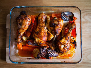 Wall Mural - Barbecue chicken drumsticks with roast vegetables