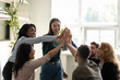 © fizkes - Associates giving high five starting project wish success each other