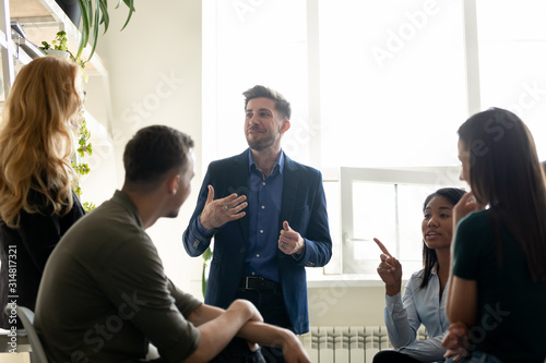 Cuadros en Lienzo Office members chatting during break gathered together in coworking space
