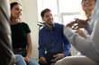 © fizkes - Diverse people attending at group therapy session listening psychologist counsellor