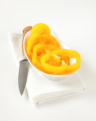 Wall Mural - Yellow bell pepper slices in bowl