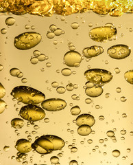 Wall Mural - golden yellow bubble oil droplet, abstract background