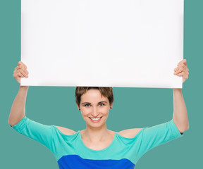 woman billboard. Young beautiful woman showing blank white placard. on background jungle shade green color