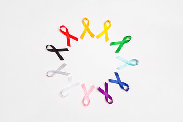 Wall Mural - World cancer day concept, February 4. Circle of  colorful awareness ribbons on white background. Copy space for text.