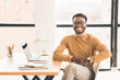 © Prostock-studio - Portrait of happy black manager looking at camera