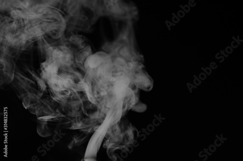 Fotomural White smoke on a black background