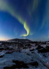 Wall Mural - Northern lights above an arctic landscape 