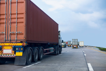 Truck on highway road with red container, transportation concept.,import,export logistic industrial Transporting Land transport on the asphalt expressway with blue sky