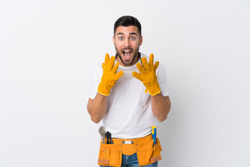 Wall Mural - Craftsmen or electrician man over isolated white background with surprise facial expression