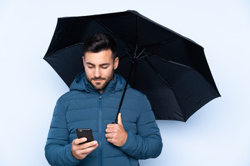 Poster - Man holding an umbrella over isolated background