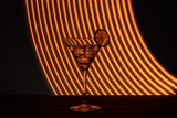 Fototapeta Dmuchawce - Glass of martini with ice shot in a long exposure in neon light