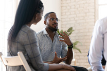 African American Man Speak At Group Therapy Session
