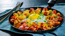 Fried Egg With Sausage And Potato In A Frying Pan