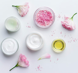 Wall Mural - skincare beauty treatment plant-based products with pink rose petals