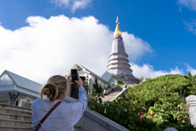 Blonde Girl Taking A Photo Of Chiang Mai Pagoda