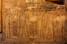 Hieroglyphic Carvings On The Exterior Walls Of An Ancient Egyptian Temple