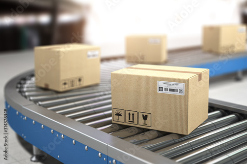 Cuadros en Lienzo Сardboard boxes on conveyor in warehouse