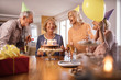 © Drazen - Happy mature people having fun while celebrating Birthday at home.