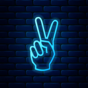 Glowing neon Hand showing two finger icon isolated on brick wall background. Victory hand sign. Vector Illustration