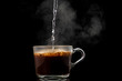 making instant coffee in a mug on a black background