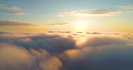 aerial clouds to the sky in motion. aerial view white clouds in blue sky during sunrise or sunset. a
