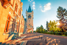 Colorful Evening View Of Cultural Palace Iasi. Sunny Summer Cityscape Of Iasi Town, Capital Of  Moldavia Region, Romania, Europe. Architecture Traveling Background.