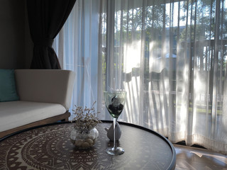 White curtain on window  and interior of the Resort hotel room.