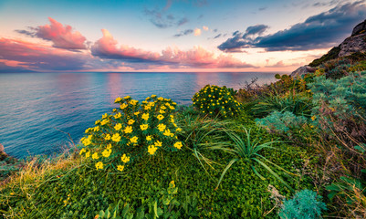 Calm spring view of Milazzo cape. Stunning sunrise on Sicily, Italy, Europe. Amazing seascape of Mediterranean sea. Beauty of nature concept background.