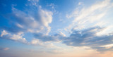 Fototapeta  - Blue sky clouds background. Beautiful landscape with clouds and orange sun on sky