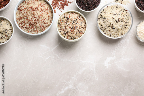 Different sorts of rice on light grey marble table, flat lay Tableau sur Toile