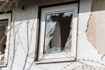 Broken Windows in the house. Shards of glass remained in the window.