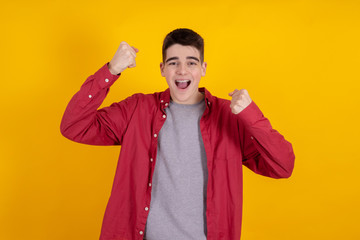 Poster - young teenage man or student isolated on color background