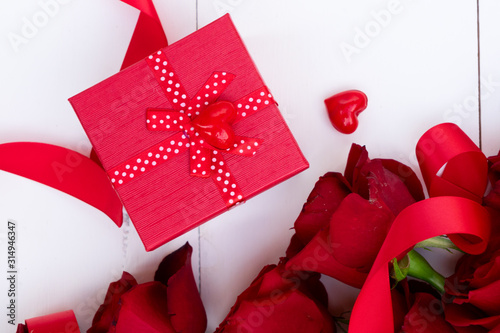 Red blooming roses on wood