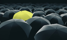 Yellow Umbrella In Mass Of Black Umbrellas.