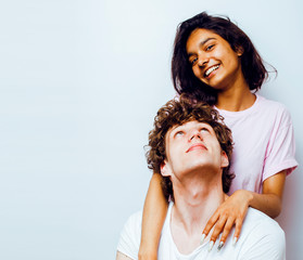 best friends teenage girl and boy together having fun, posing emotional on white background, couple happy smiling, lifestyle people concept, blond and brunette multi nations close up