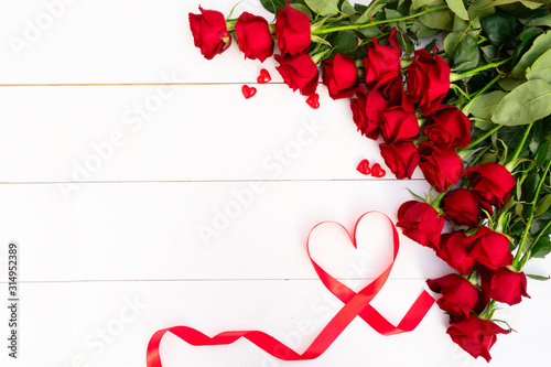 Red blooming roses on wood