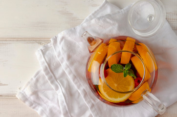 Wall Mural - Fruit hot tea with the addition of oranges, lemons, raspberries and mint