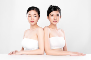 Portrait Two beautiful young asian woman clean fresh bare skin concept.  Asian girl beauty face skin care and health wellness, Facial treatment, Perfect skin, Natural make up, on white background