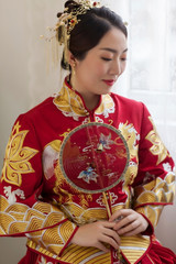 Asian girl wearing chinese wedding costume